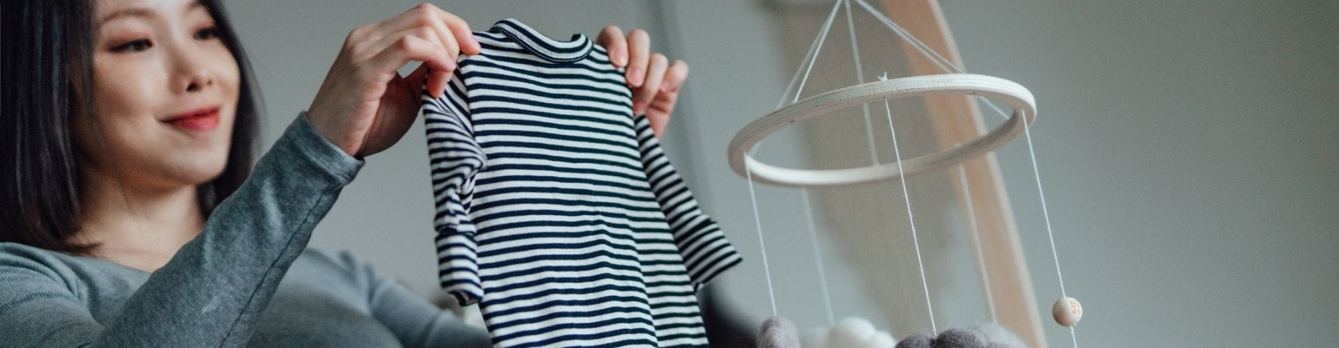 Mom-to-be preparing nursery for baby