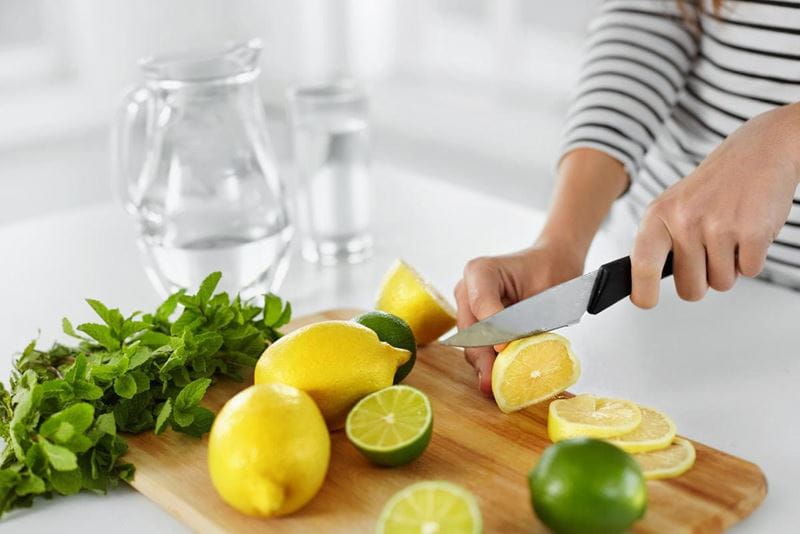 cutting-lemon-and-lime-for-infused-water