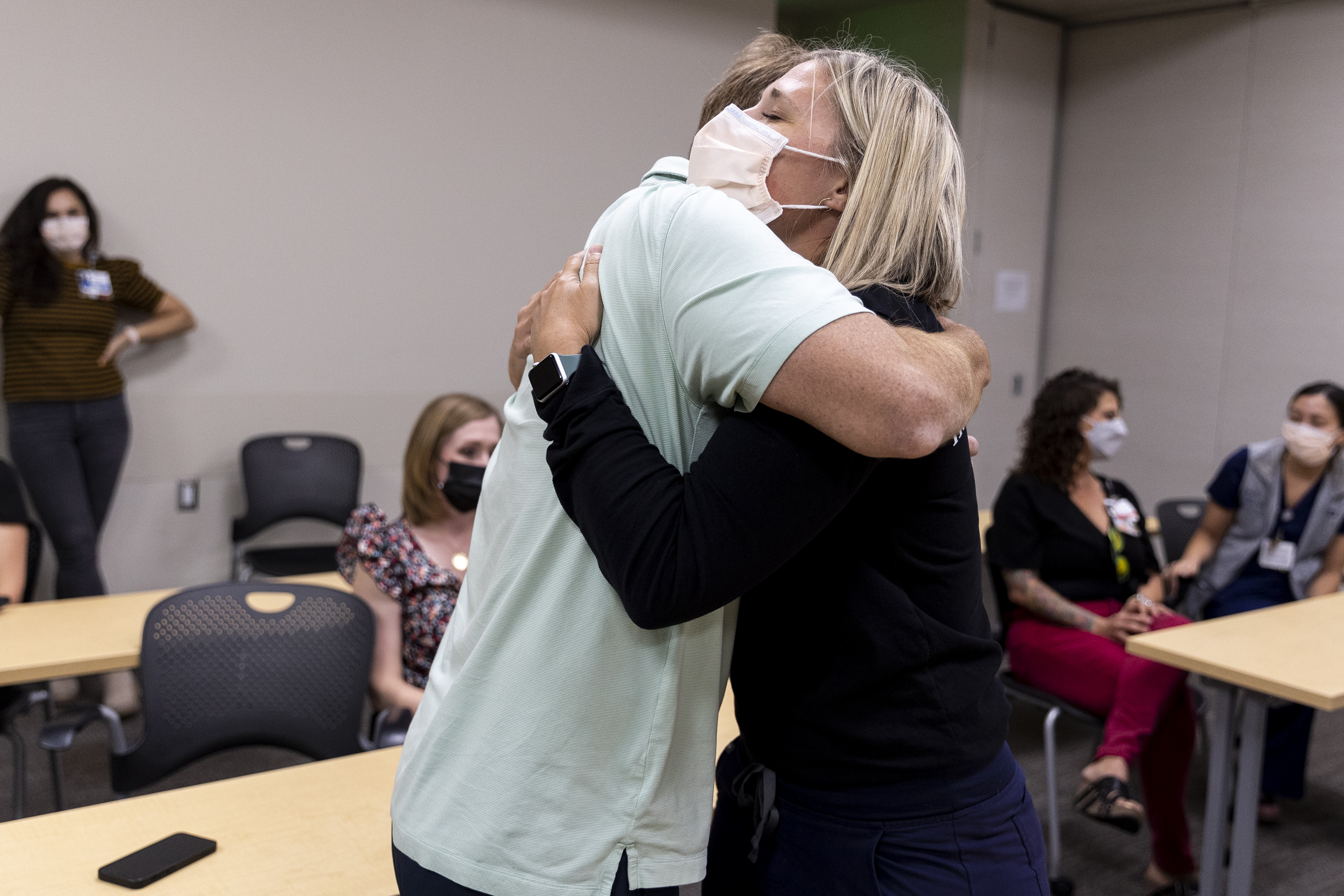 Former patient Neal Brown hugs Marie Hilton, RN, one of his nurses